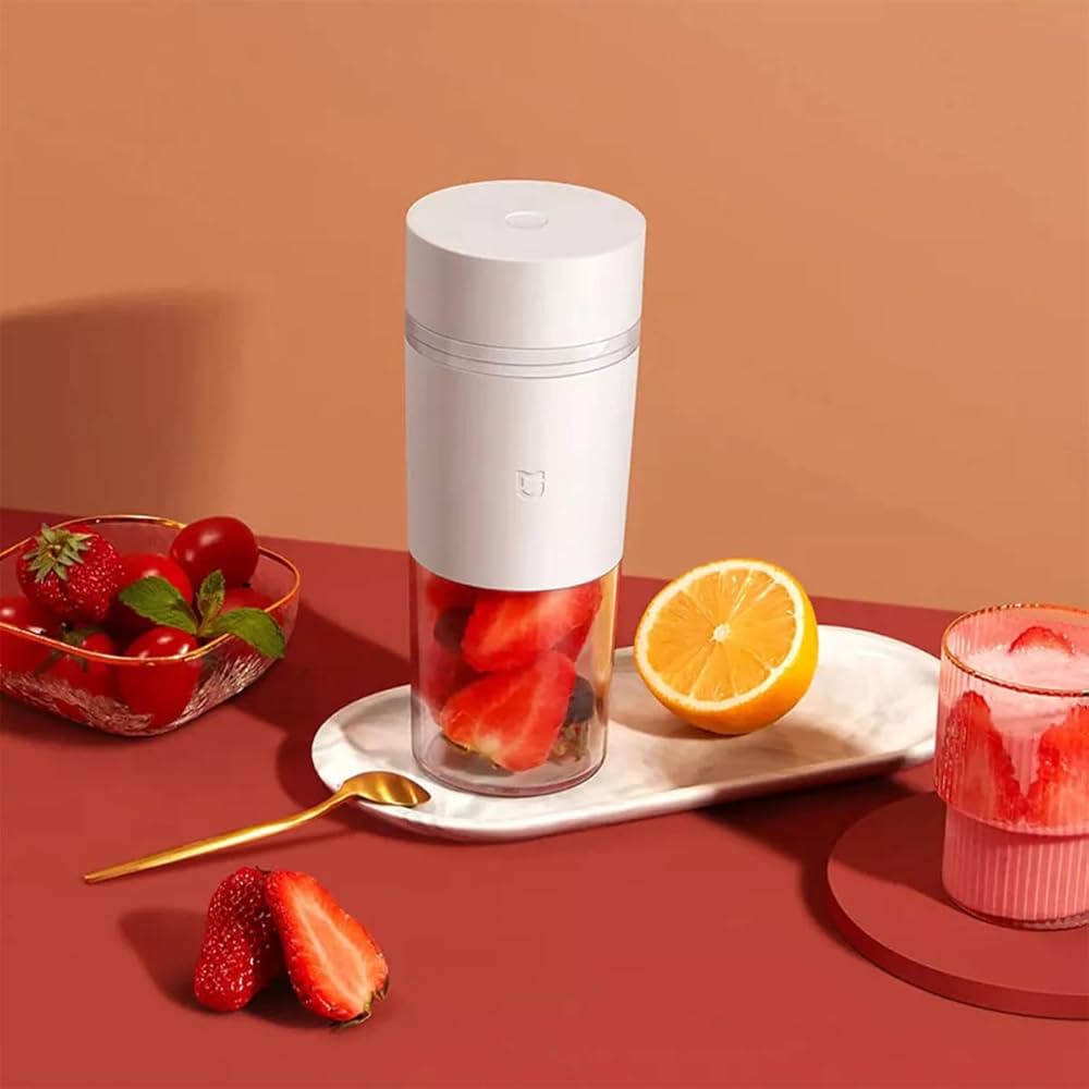 White Xiaomi Mijia portable juicer cup and blender, compact and sleek with a smooth finish and built-in blending blades.