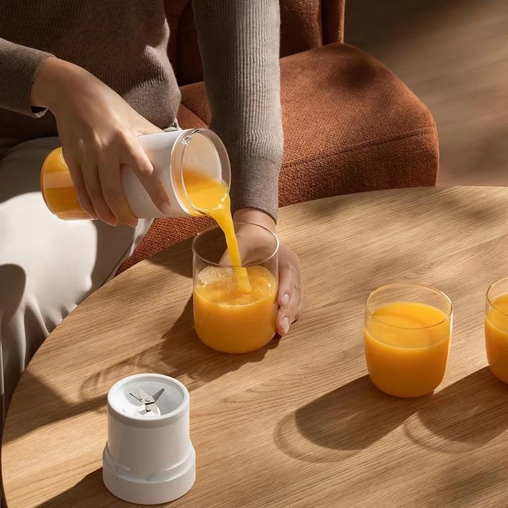 Xiaomi Mijia portable blender cup in white with transparent body and blending blades visible inside.