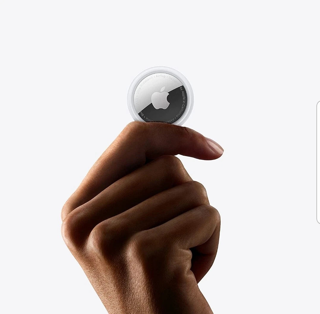 Apple AirTag 2nd Generation tracking device by Apple, showing a close-up of the sleek circular design and white finish.
