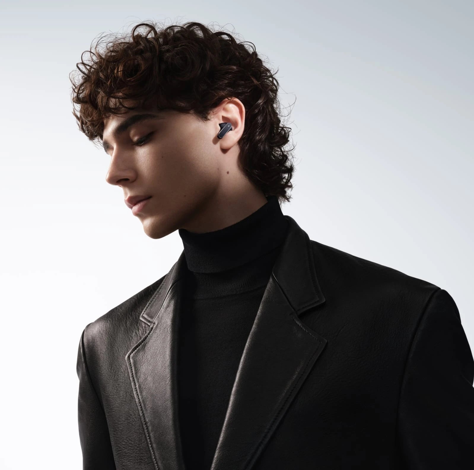 Huawei FreeBuds Pro 5 wireless earbuds with dual-engine active noise cancellation and sleek grey color.