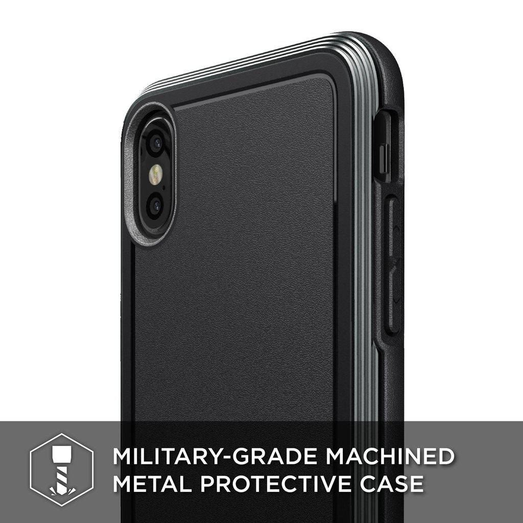 Black Defense Ultra X-Doria iPhone Xs case with anti-shock design and textured grip, showing the rugged exterior and precise cutouts.