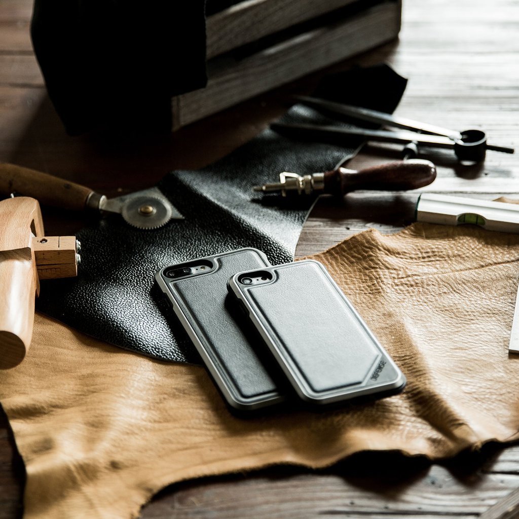 Black Defense Lux Leather anti-shock case for iPhone 8 Plus and 7 Plus by X-Doria, with rugged protection and sleek leather design.