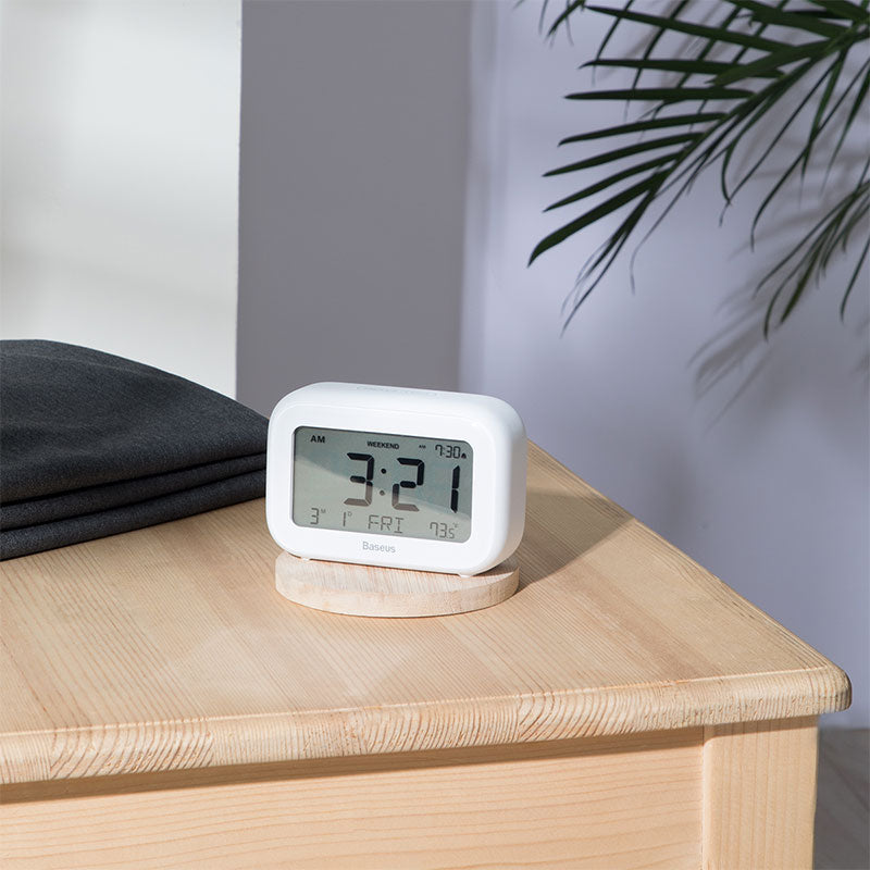 Smartkoshk Subai من بيسوس smart alarm clock with LCD display showing time, date, and temperature.