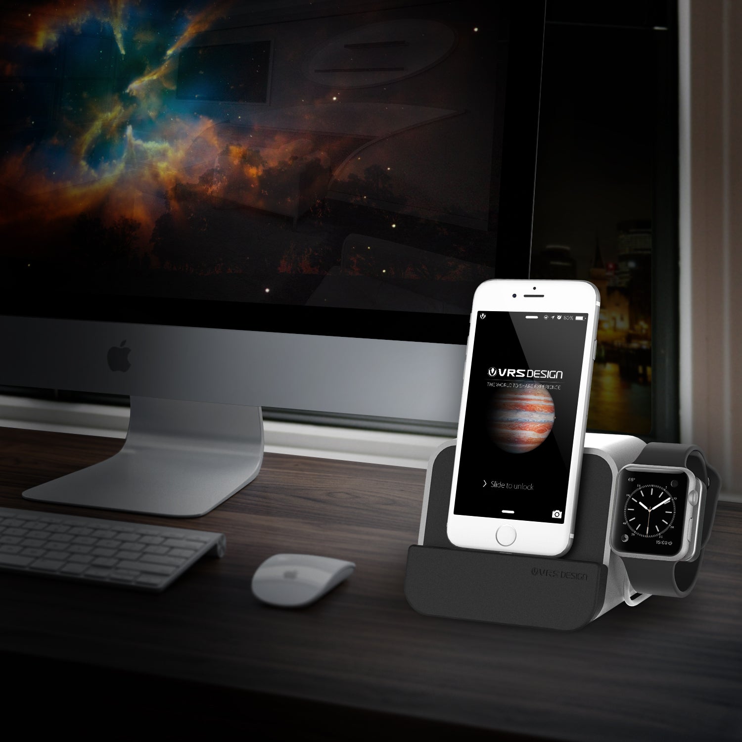 Silver VRS iPhone charger and Apple Watch stand set against an iMac background, showcasing sleek design and functionality.