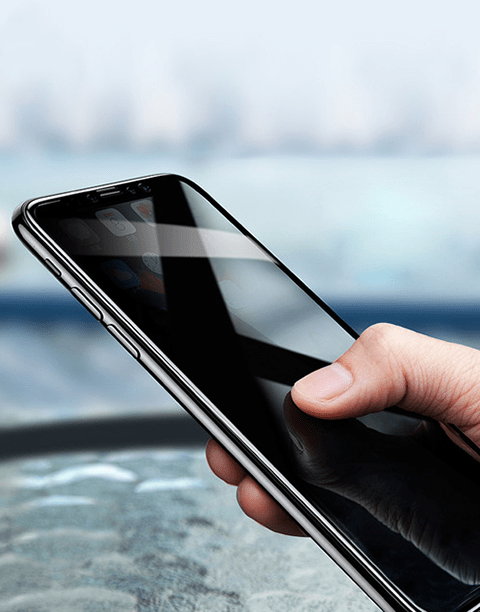 Black Baseus Arc-surface anti-peeping tempered glass screen protector for iPhone X, showing the dark privacy filter feature.