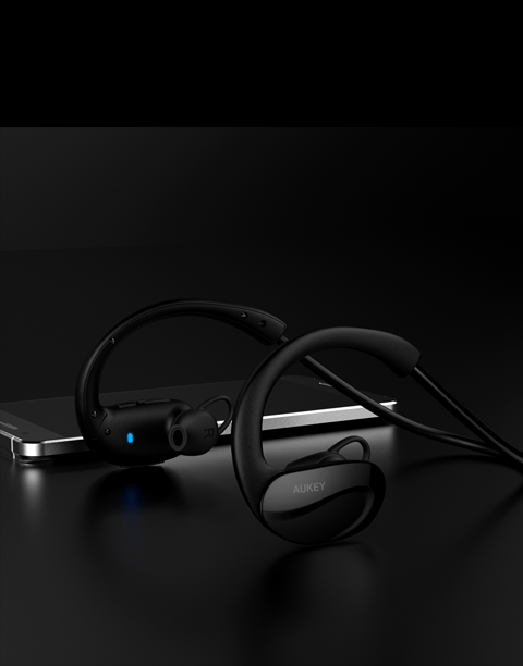 Black Aukey EP-B34 wrap-around wireless fitness headphones with sweat-resistant design.