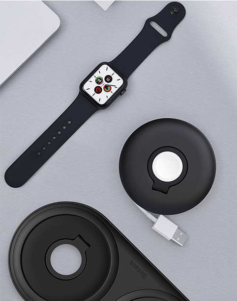 Black Baseus Planet cable winder for Apple Watch, neatly organizing charging cables with a space-themed design.