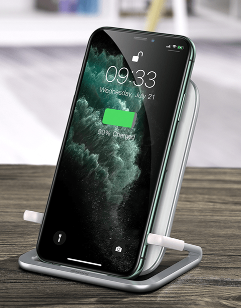 White Baseus Rib 15W fast wireless charger with horizontal design, shown with a smartphone placed on the charging pad.