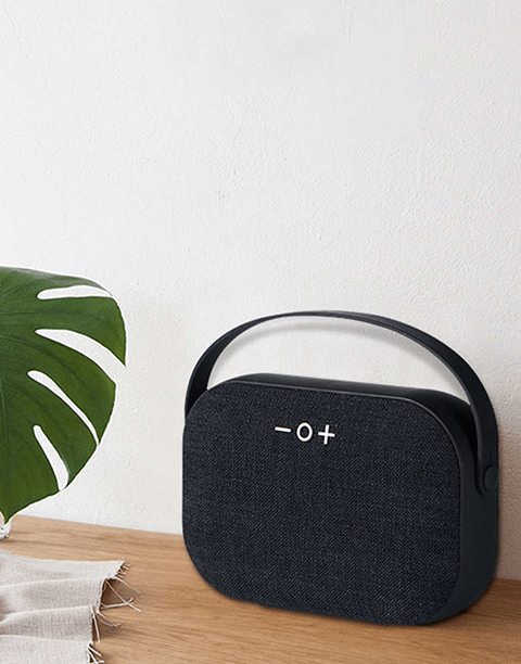 Smartkoshk M4 wireless speaker with Aux port, SD card slot, and call answering feature, shown in a sleek black design.