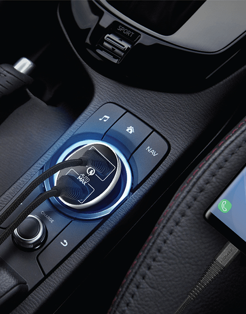 Smartkoshk Momax UC9 dual car charger with QC3.0 fast charging technology in black, shown plugged into a vehicle's cigarette lighter.