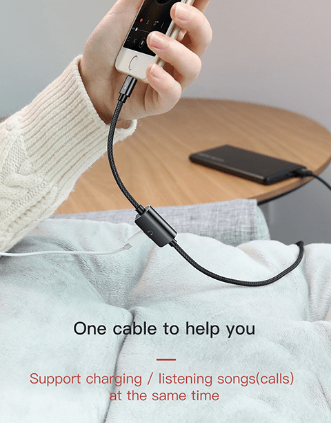 Baseus 2-in-1 iPhone charging and listening to music adapter showing a phone connected for simultaneous power and audio use.