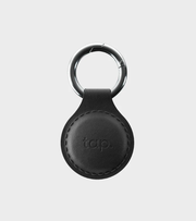 Black handmade leather Tap NFC keychain with engraved tap icon, designed for easy sharing with a simple tap.