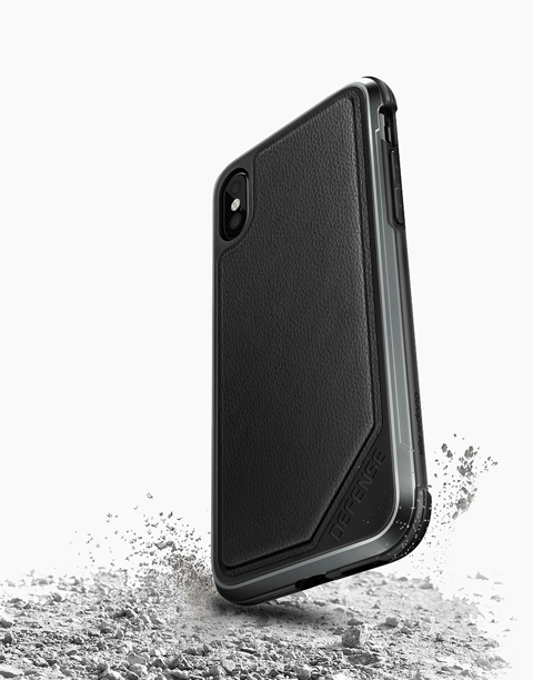 Black Defense Lux leather case for iPhone Xs by X-Doria, with anti-shock protection up to 3M, shown on a white background.