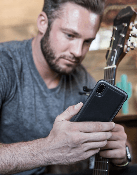 Black Defense Lux Leather iPhone Xs case by X-Doria with anti-shock protection up to 3M, featuring durable leather design.
