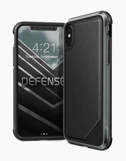Black Defense Lux Leather X-Doria iPhone Xs case with anti-shock design and 3M protection, featuring sleek leather finish.